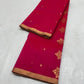 A timeless classic, this Rani pink Chanderi silk saree is a celebration of heritage and elegance. Crafted from lightweight silk with a luxurious sheen, the saree features all-over gold zari floral leafy buttas