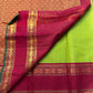 Maavilai Arakku Chakram — Korvai Kanchipuram Pure Silk

Parrot-green vaira-oosi body with soft pin-stripe sheen

Contrast arakku/rani border with gold chakram medallions & temple motifs

Arakku pallu with all-over coin-jaal; contrast blouse included