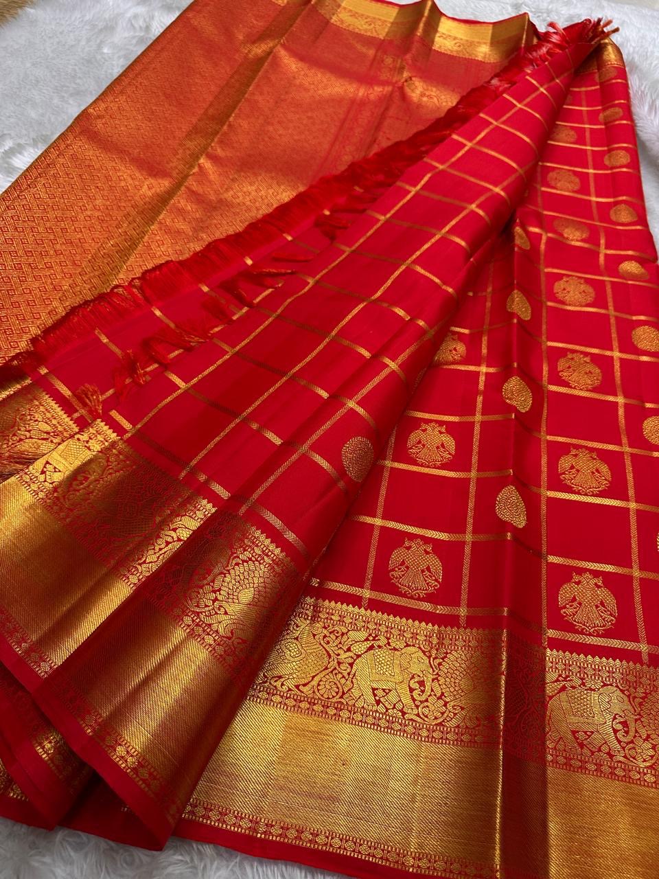 Srija – Red-Orange zari kattam  Kanchipuram Pure Silk Saree with Zari Checks, Kamalam Buttas & Vanasringaram Border