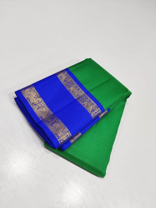 Verdant Sapphire – Pure Kanchipuram Silk Saree
Lush Green Body with Zari Kattam Checks ✨
Royal-Blue Rettapet Border with Gold Zari
Grand Royal-Blue Diamond Brocade Pallu

Silk Mark Certified, delivery in 2 weeks