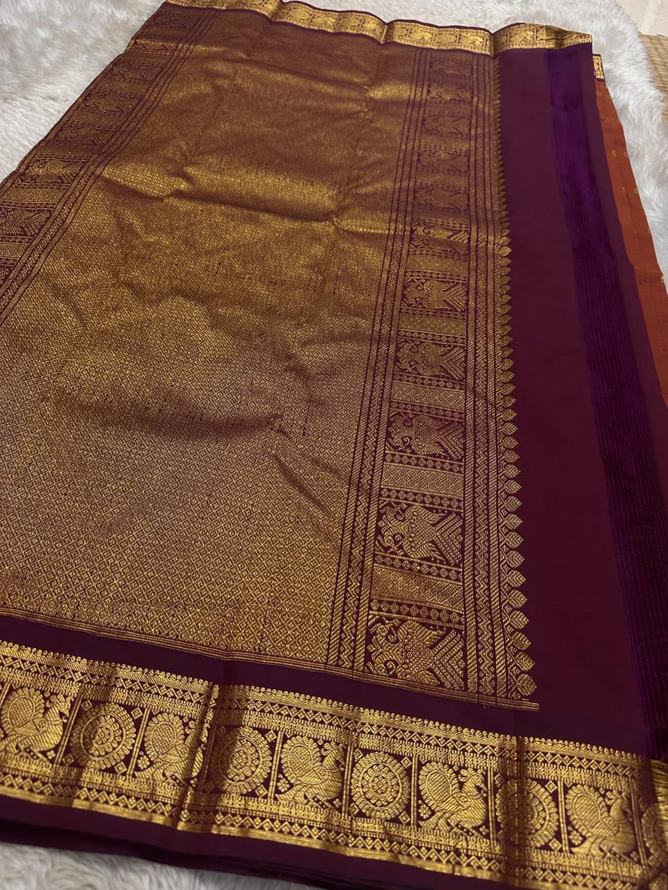 Swaram Lightweight Maroon
Feather-Light Maroon Kanchipuram Silk Saree
Zari-Woven Peacock Medallion Border