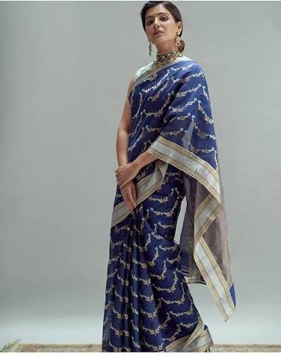 Pure Silk Chanderi Saree in Royal Blue with Teal–Gold Floral Vine Motifs
Silver–Gold Tissue Borders with Subtle Striped Pallu
Fall & Pico Done • Blouse Stitching Available ($30) • Free Shipping within USA • Ships in Two Weeks