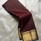 Kapi Ratna Kattam
Coffee-Deep Brown Zari Grid Saree
Pure Kanchipuram Handloom • Temple Gold Borders