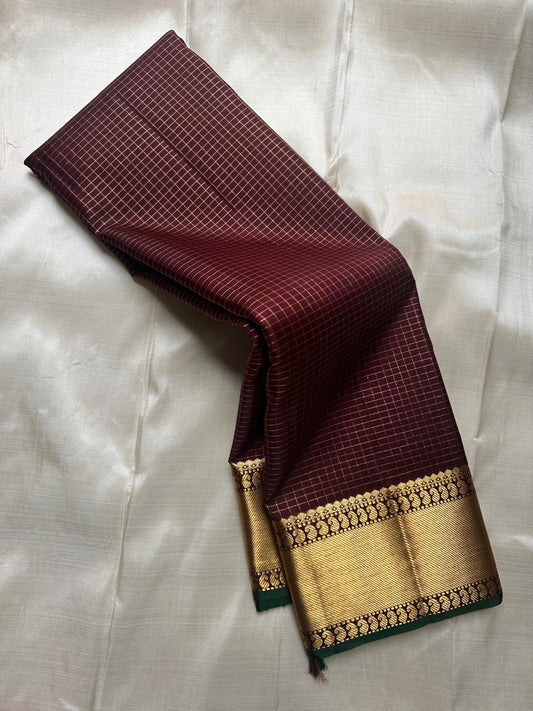 Kapi Ratna Kattam
Coffee-Deep Brown Zari Grid Saree
Pure Kanchipuram Handloom • Temple Gold Borders
