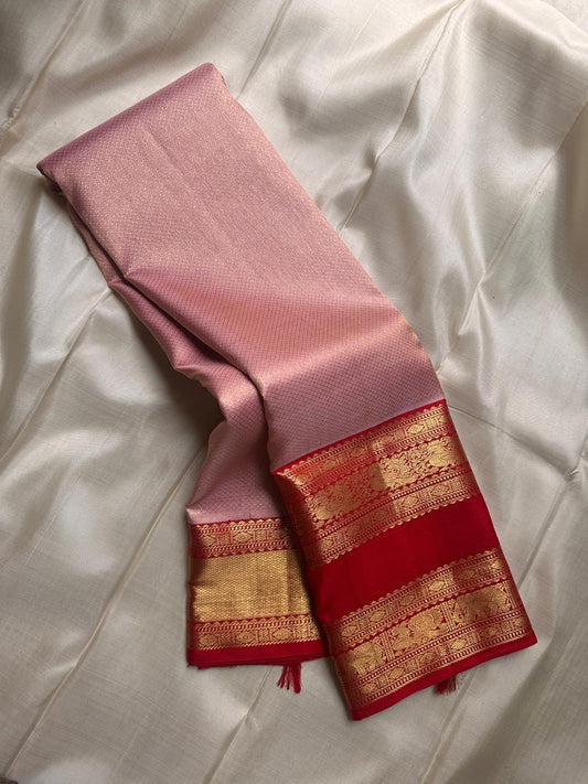 Calm pastel pink meets bold vibrant red , pure silk Kanchipuram rettapettu border annam motif