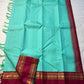 Neer Pachai Vairaoosi — Kanchipuram Pure Silk saree 

Sea-foam/aqua body with classic Vairaoosi pinstripes

Contrast ruby-maroon korvai borders with gold chakram & floral panels

Grand maroon pallu with all-over chakram jaal and paisley vines; aqua tassel