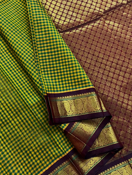 Silk Cotton Saree ✨ – Green & Mustard Checks with Maroon Zari Diamond Weave
Vibrant Checked Body in Green & Mustard Yellow
Rich Maroon Base with Intricate Zari Diamond Motifs
Grand Maroon Border with Floral & Paisley Zari Work