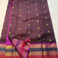 Coffee Brown Rajam – Pure Kanchipuram Silk Saree
Coffee Brown Body with Gold Zari Buttas
Rani Pink Korvai Borders with Temple, Peacock & Elephant Motifs
Grand Rani Pink Zari Brocade Pallu with Vertical Stripes & Tassels
Silk Mark | ships in two weeks
