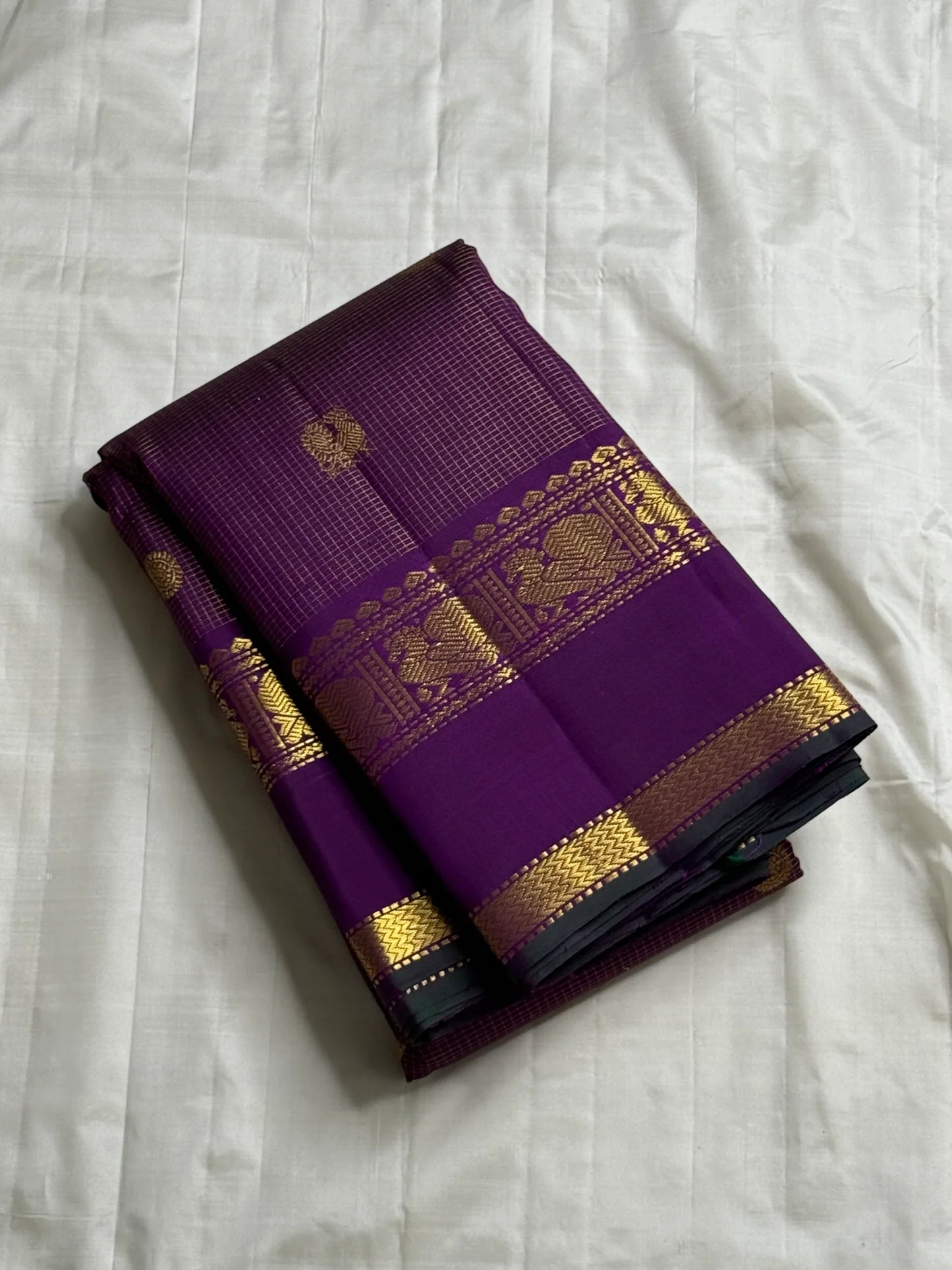 Kalika Purple — Pure Silk Kanchipuram Saree
Royal Purple with Gold Coin & Kalika Paisley Zari Buttas | Annapakshi Panel Border | Brocade Pallu
**Silk Mark Certified ✅ •ships in 2 weeks