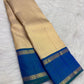 Grand peacock-blue and green shot-colour Kanjivaram pallu densely woven with gold geometric and floral zari bands.