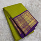 Chartreuse green Pure Silk Kanjivaram saree with rich indigo border and heritage Annapakshi weaving