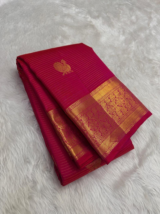 Radiant pink pure Kanchipuram silk saree with Mayil Butta motifs and antique gold zari border