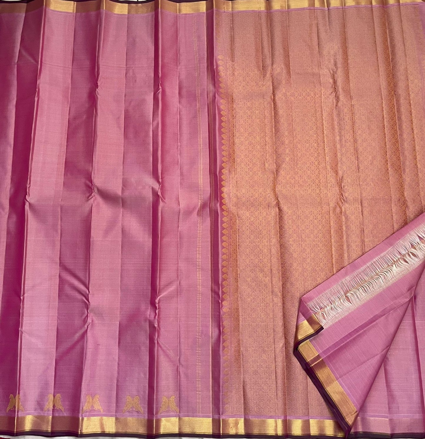 Pure Kanchipuram silk saree in pastel pink with antique gold zari weaving