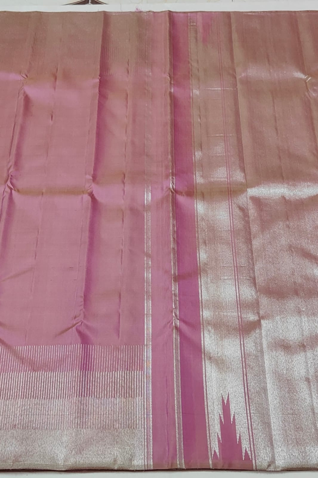 Ettukol weave detail on pure silk pink Kanchipuram saree with structured zari work