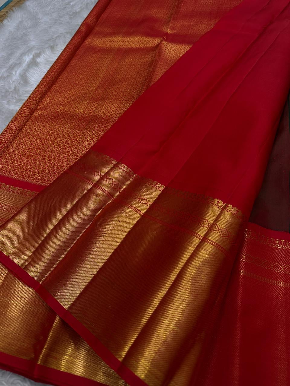 Aubergine Purple pure silk Kanchipuram saree, Vairaoosi weave with Antique Gold Zari border — folded view