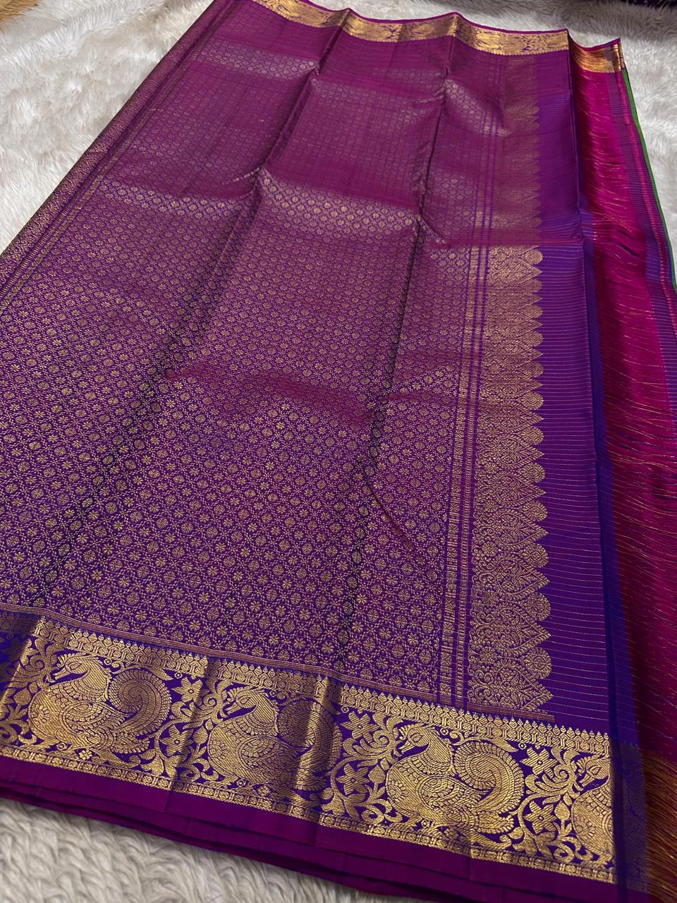 Vrindavan Meadow
Peacock Vairaoosi in Emerald & Lagoon Blue
Pure Kanchipuram Silk · Zari-Woven Border Grandeur