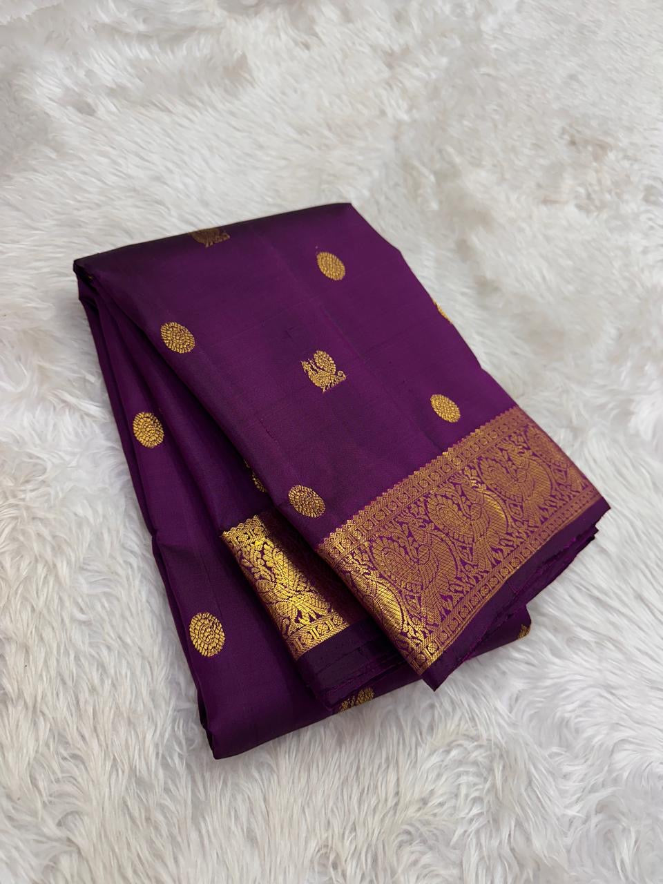 Authentic Kancheepuram silk saree featuring jamun-toned purple silk and intricate gold zari craftsmanship