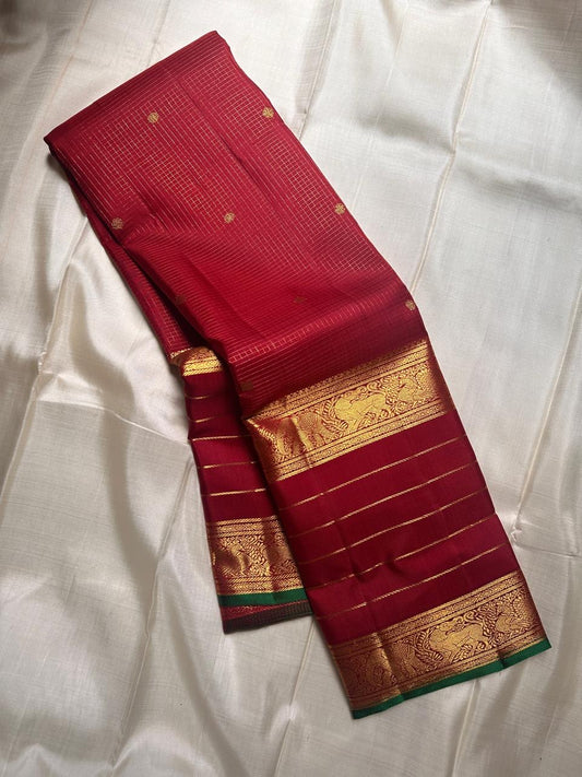 Pure silk kanchipuram maroon Zari  kattam  with butta rettapet border with Zari stripes intricate pallu with green selvedge “ restocked on demand “