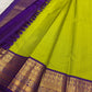 Pure silk Kanchivaram saree with vibrant green body and royal indigo contrast pallu