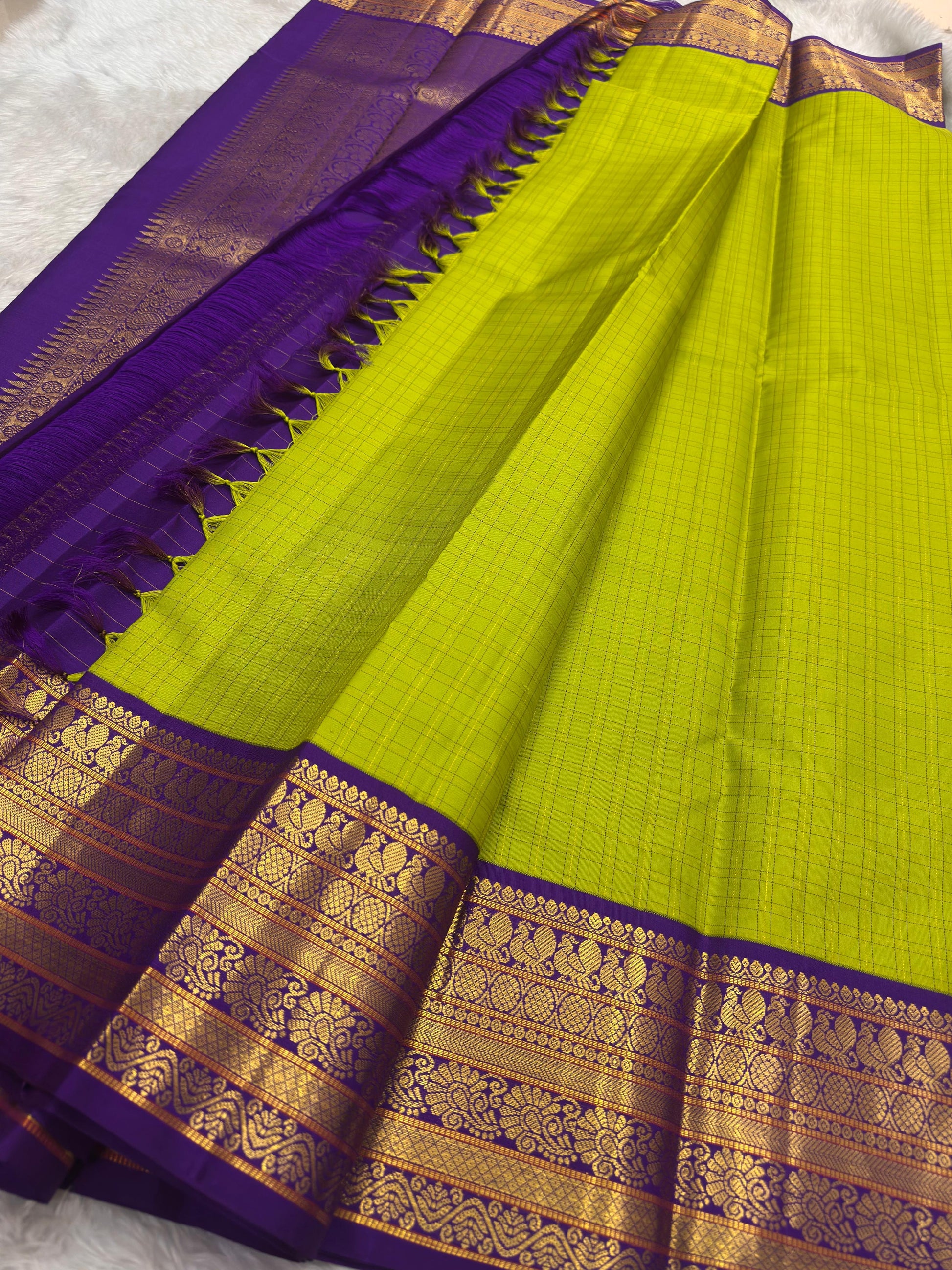 Pure silk Kanchivaram saree with vibrant green body and royal indigo contrast pallu