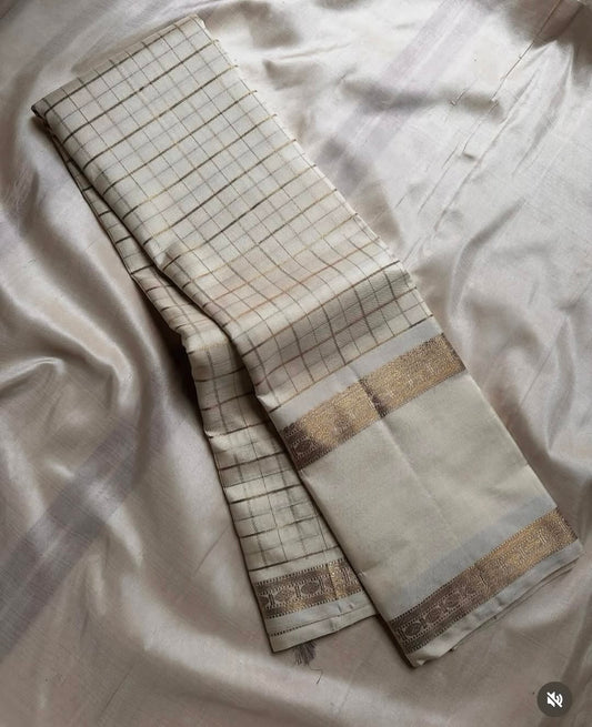 Sathia – A Radiant Ivory Kanchipuram Silk Saree with Zari Checks, Rettai Pet Rudhraksham Borders & a Grand Pallu Woven in Sacred Rudhraksham Motifs