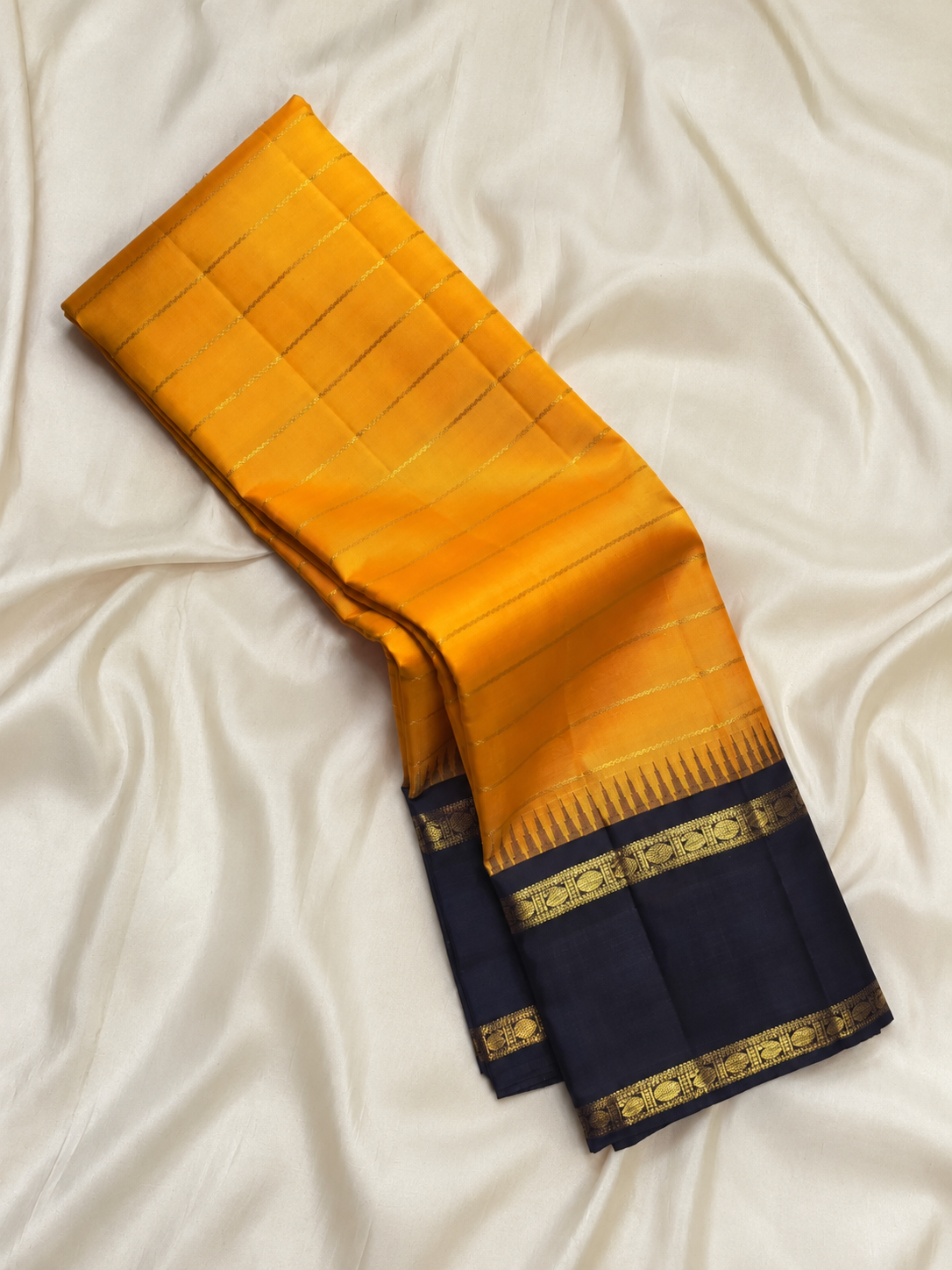 Golden Yellow Pure Silk Kanchipuram Rettapet saree with Deep Indigo zari border
