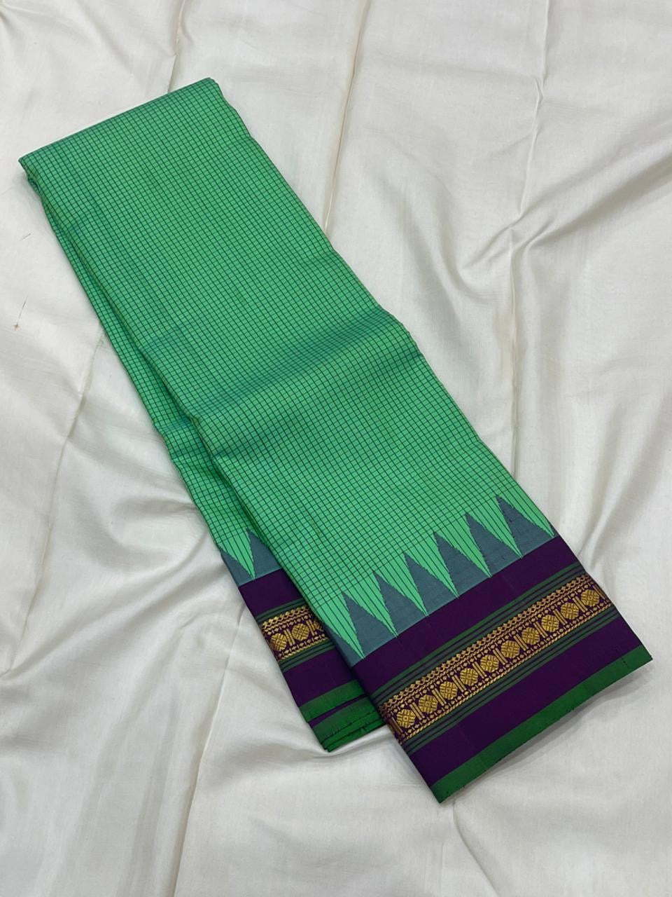 Jade Green Kattam Body • Plum-Purple Zari Border
Temple Triangles & Floral Bands
Silk Mark Certified • Free USA Shipping • Ships in Two Weeks ✅