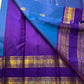 Azure Blue Purple Horizon – Neelam blue body with royal-purple korvai borders  Pure Kanchipuram silk • manga (paisley) buttas + fine pin-stripes  Opulent purple brocade pallu • contrast blouse with zari border  Silk Mark Certified | Fall & Pico Done |
