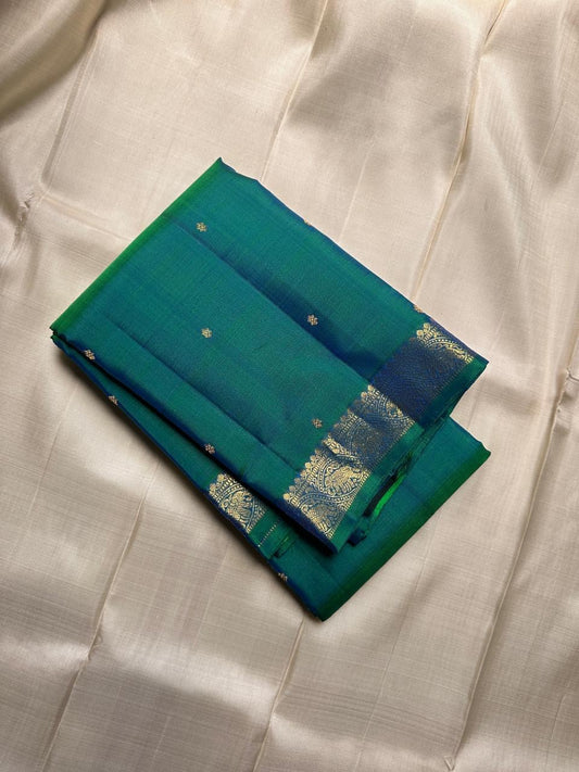 Peacock green blue shot pure silk Kanchipuram saree with vanasringaram border and Pallu