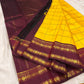 Marigold Yellow & Arakku Pure Silk Kanchipuram Saree
Classic kattam checks across the radiant marigold body
Deep arakku-maroon korvai borders with coin medallion zari
Rich maroon pallu with traditional zari  motifs
Silk Mark Cert • Ships in 2 weeks