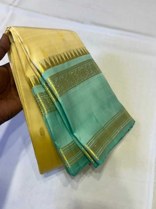 Sunlit Butter Yellow ✨ – Pure Kanchipuram Silk Saree in Butter Yellow & Sea Green with Gold Zari Temple Border & Grand Brocade Pallu – Silk Mark Certified, Fall & Pico Done, Blouse Stitching Available, ships in 2 weeks