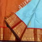 Kamadhenu — Pure Silk Kanchipuram
Sky-blue body with gold Kamadhenu motifs, fiery-orange pallu & ruby-red korvai borders ✨
Silk Mark Certified • Antique Zari Weave • Ships in Two Weeks • Free Shipping within USA