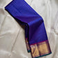 Sapphire Zari Kattam – Pure Kanchipuram Silk Saree
Brilliant Sapphire Blue Body with Gold Zari Checks
Broad Golden Border with Magenta Highlights & Temple Motifs
Royal Magenta Pallu with Lustrous Zari Stripes

Silk Mark Certified, delivery in 2 weeks
