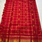 Ravi Kiranam — Sona Roopa Kattam Kanchipuram Pure Silk

Vibrant festive red body with allover kattam (grid) checks

Gold & silver sona-roopa zari alternating for a soft shimmer

Grand kaddi border with rich zari paisley vines & floral tracery

Silk Mark