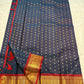 Midnight Neelam Flower Butta — Kanchipuram Pure Silk


Deep midnight neelam (navy) body with scattered gold flower buttas

Korvai contrast maroon borders with grand + geometric zAri motifs 

Rich zari pallū with ornamental motifs; hand-twisted tassels