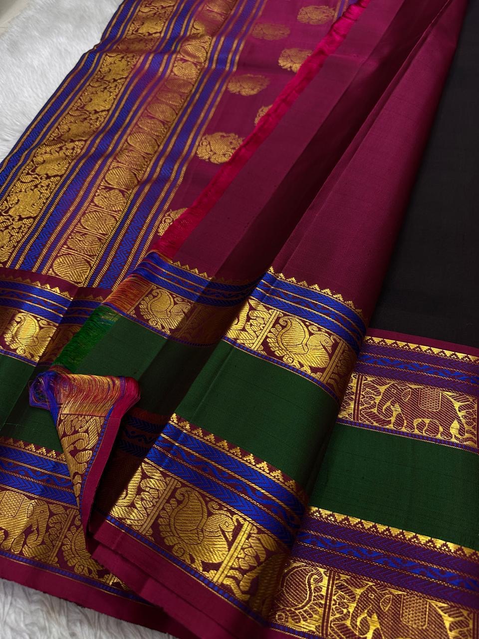 Mahathi Kanjivaram — Black Silk with Elephant Zari Borders
Deep Black Body • Green & Maroon Contrast • Blue Temple Highlights
Silk Mark Certified • Free Shipping within USA • Ships in Two Weeks