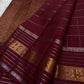 Pankajam 🌺 – Brown maroon Kanchipuram Silk Saree with Zari Kattam, Dashed Lines, Kolam Motifs, Varisaipet Border with Thandavalam Zari Stripes, Rudrakshpet, Annam & Kamalam Motifs, Deep Brown Selvedge & Ornate Pallu