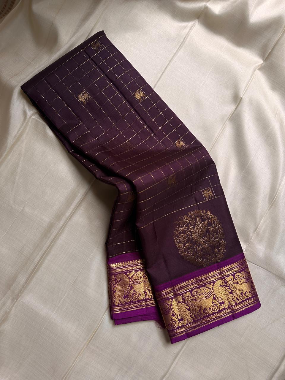 Sorgavaasal Kili , stunning motif in dark brown and purple zari kattam zari woven yazhi buttas in pure silk kanchipuram
