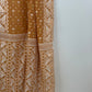 Full drape of biscuit-brown Jamdani saree with intricate ivory border detailing