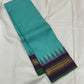 Gopura Neelam — Kanchipuram Pure Silk Saree

 

 

Teal-green body with micro kattam checks for a sleek drape

Regal aubergine korvai border with gopuram/temple motifs & gold zari

Parrot-green selvedge for a fresh, festive pop of contrast

Aubergine pall
