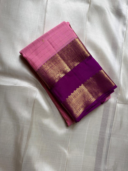 Blush Lattice – Pure Kanchipuram Silk Saree
Pleasant Pink Body with Zari Kattam Checks
Petite Kamalam Buttas Scattered Across the Body
Contrast Purple Rettapet Border with Ornate Motifs
Grand Purple Pallu. Silk Mark Certified, delivery in 2 weeks