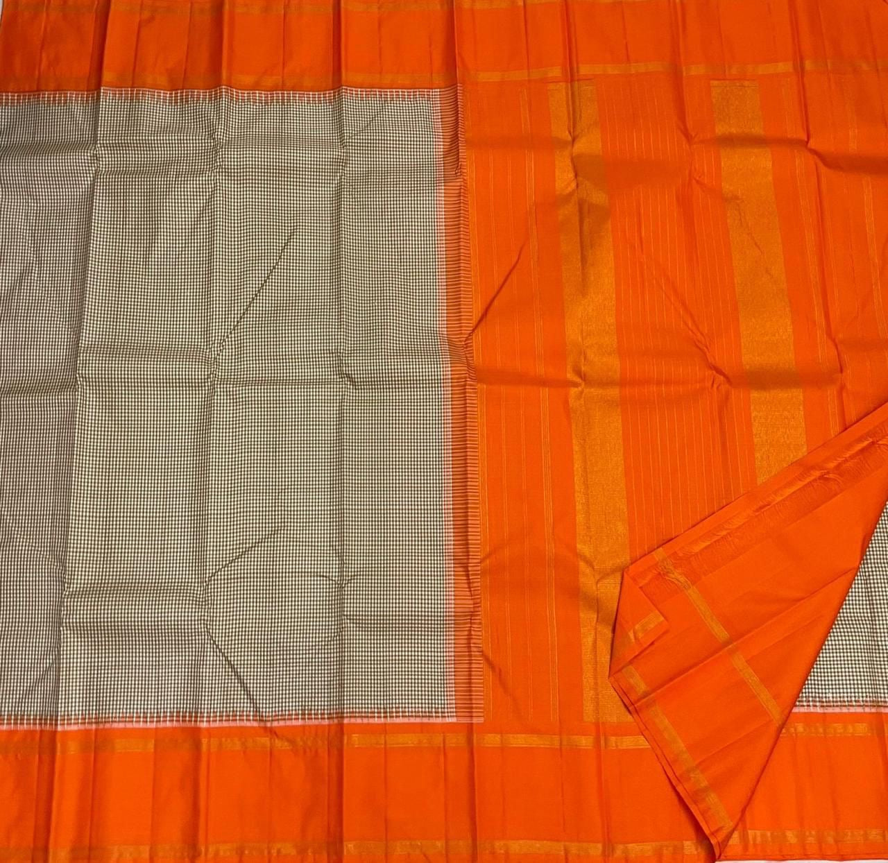 Rust Kattam Korvai – Pure Silk Kanchipuram Saree
Olive–Ivory Micro-Checks Body with Korvai Join
Rust Orange Border
Rust Orange Pallu pillayar Reku
Comes with Matching Rust Orange Blouse Piece with Zari Border silk mark certified - ships in 2 weeks