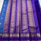 Azure Blue Purple Horizon – Neelam blue body with royal-purple korvai borders  Pure Kanchipuram silk • manga (paisley) buttas + fine pin-stripes  Opulent purple brocade pallu • contrast blouse with zari border  Silk Mark Certified | Fall & Pico Done |