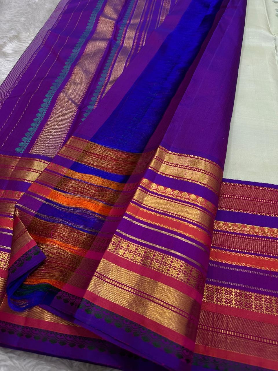 Kumari ✨ – Pastel Sage Green Kanchipuram Pure Silk Saree
with Delicate Golden Floral Buttas 🌸
Purple–Red Korvai Varisaipet Zari Border
Grand Purple Pallu with Stripes & Floral Vines
An Heirloom of Grace, Heritage & Festive Splendor