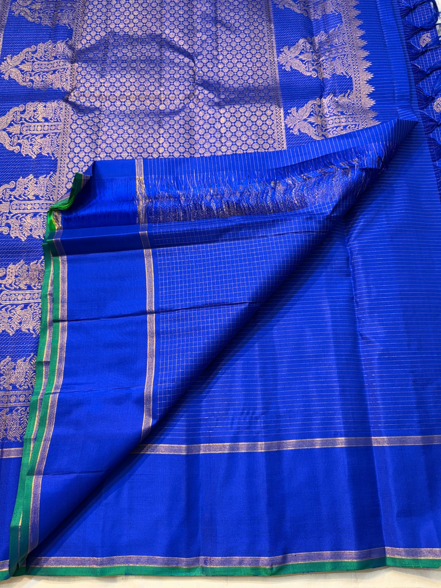Vriksha Neelam Zari Kattam — Pure Kanchipuram Silk Saree 💙
Royal Neelam Blue with Fine Kattam Checks & Temple-Tree Zari Motif ✨
Silk Mark Certified • free shipping within Usa ,ships in two weeks