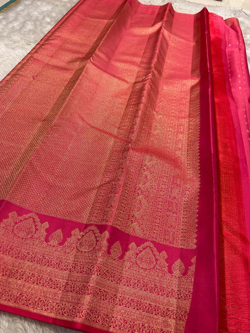 Kemp Kanchi Collection – Rosy Coral Pink
Pure Kanchipuram Silk with Gold Leaf Buttas & Temple Zari Borders
Silk Mark Certified • Free Shipping within USA • Ships in Two Weeks