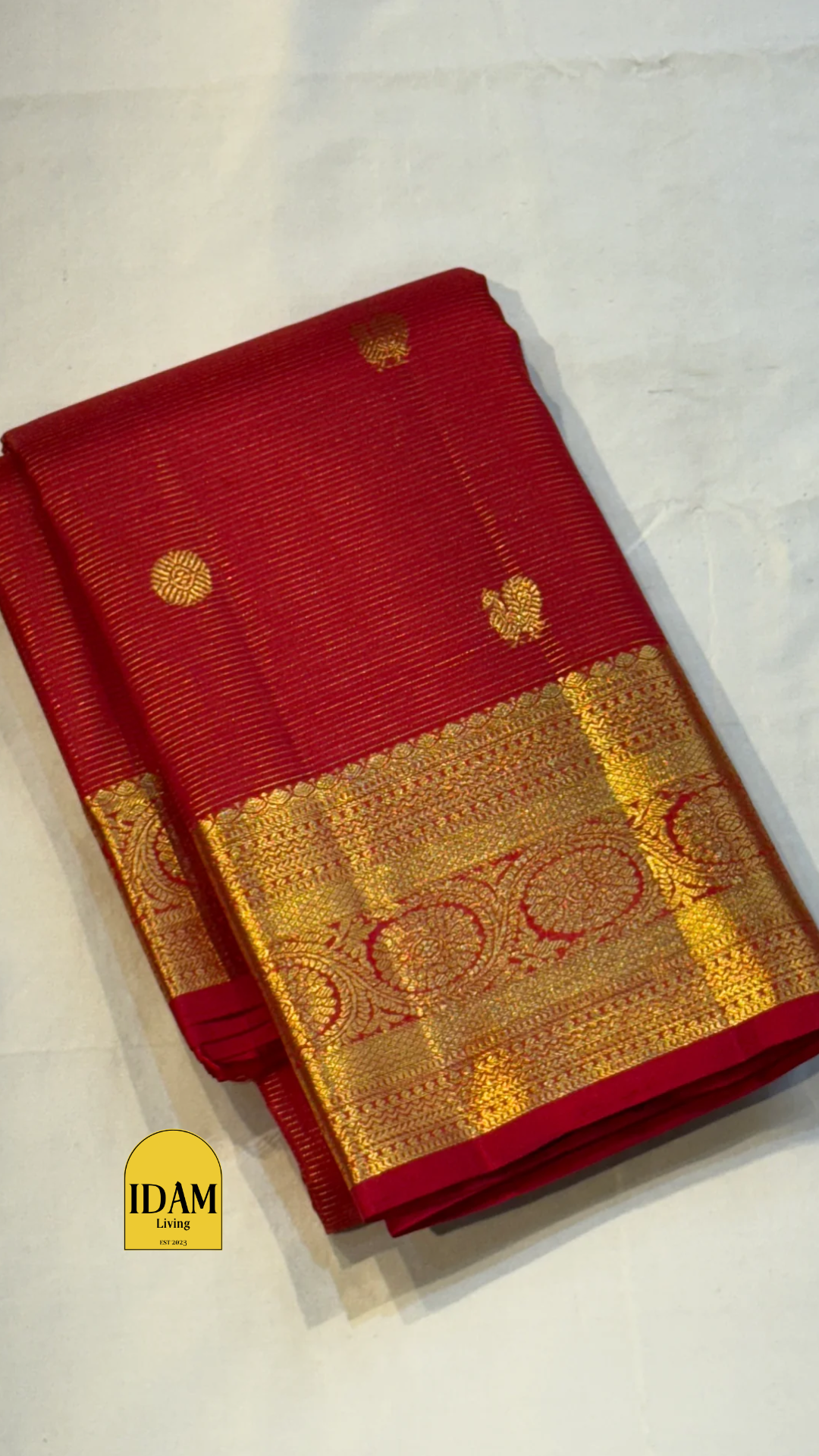 Nakshatra – Radiant Red Vairaoosi Kanchipuram Silk Saree Adorned with Mayil & Chakram Zari Buttas, Featuring an Ornate Kamalam and Floral Vine Zari Border, Flanked by Varisaipet Motifs, and a Pallu Woven with Sacred Thulasi Madams and Regal Kamalams