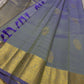 Dia ✨ – Unique Ash Lilac Grey Kanchipuram Pure Silk Saree
Gold Zari Buttas Adorning the Body
Intricate Gaja–Annam (Elephant & Peacock) Motif Border
Coordinated Ash Lilac Grey Silk Blouse Piece Included
Silk Mark Certified | Fall & Pico Done