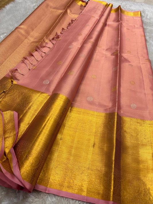 Vairaoosi -  silk Kanchipuram thanga velli ( sonaroopa) zari butta in a mesmerizing pink peach pastel korvai getti (thick ) zari border with mayil motif