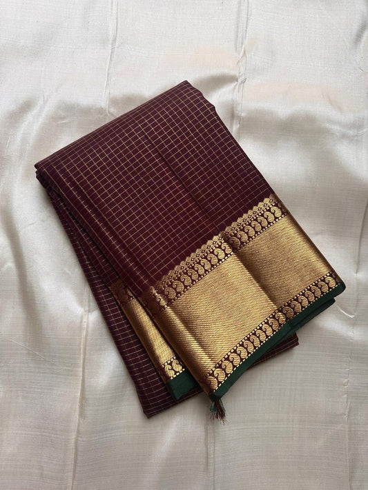 Kapi Ratna Kattam
Coffee-Deep Brown Zari Grid Saree
Pure Kanchipuram Handloom • Temple Gold Borders